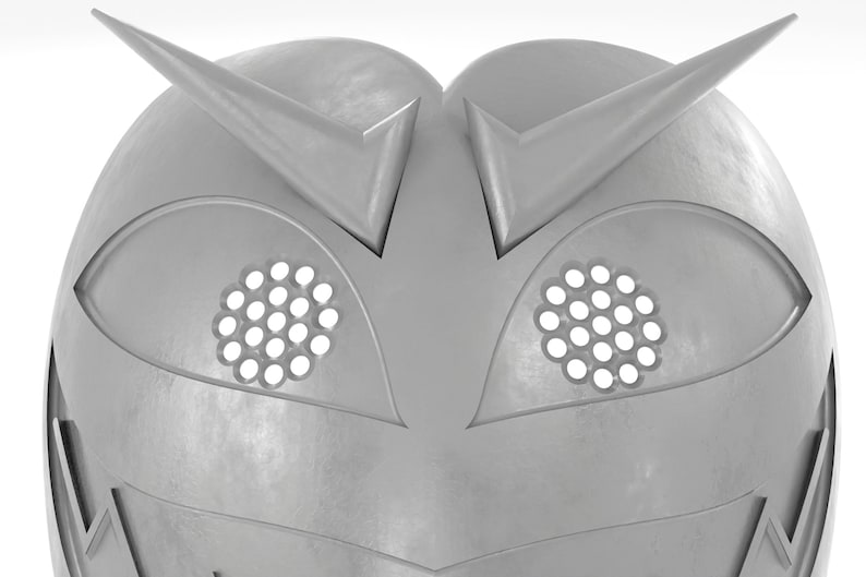 May include: A silver helmet with two pointed horns and two eye holes with a grid pattern.