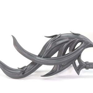 May include: A gray 3D printed fantasy weapon with a long, curved blade and a textured handle. The blade is shaped like a series of flowing, organic shapes.