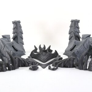 May include: A set of 3D printed gray plastic pieces for a tabletop game or miniature. The pieces are designed to resemble a dragon's head, wings, and tail.