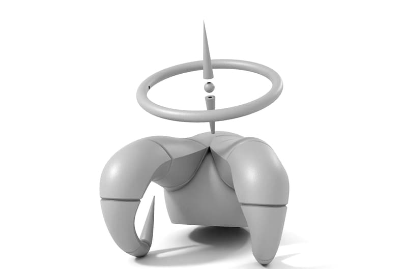 Puede incluir: Una escultura abstracta gris con tres brazos curvos y un anillo con una punta. La escultura est&aacute; hecha de un material liso y mate.