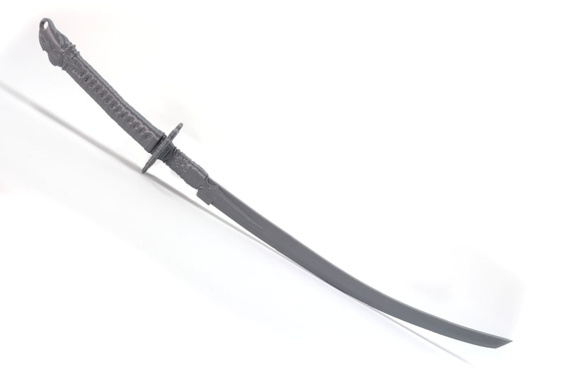 May include: A silver-colored katana sword with a detailed hilt and a curved blade.