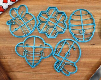Cortadores de galletas de abejas: formas de panal y colmena