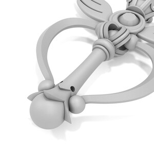 May include: A white plastic wand with a heart-shaped handle and a crown on top. The wand has a star-shaped tip and a decorative design.
