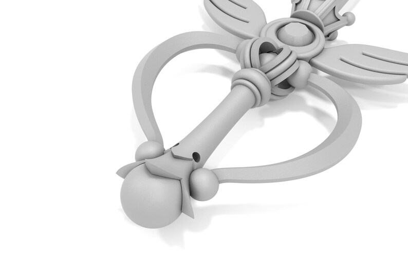 May include: A white plastic wand with a heart-shaped handle and a crown on top. The wand has a star-shaped tip and a decorative design.