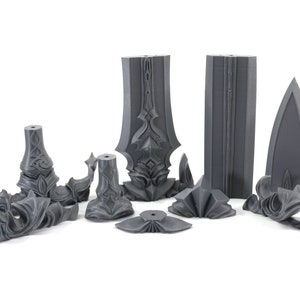 May include: A set of 10 gray plastic pieces that can be assembled into a sword. The pieces are detailed with intricate designs.