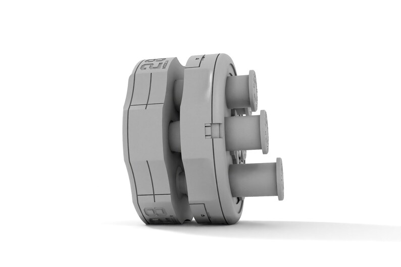 May include: A gray plastic mold with a circular base and a series of cylindrical protrusions. The mold has a textured surface and a number "25" printed on the side.