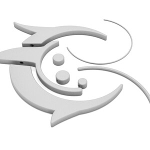 May include: A collection of white, abstract, 3D-rendered shapes. The design includes curved lines, rounded shapes, and elements resembling stylized fish or arrows. The pieces are arranged in a seemingly random, yet cohesive, composition.