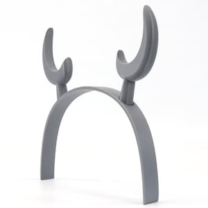 May include: A gray plastic headband with two curved horns, resembling a reindeer or bull.