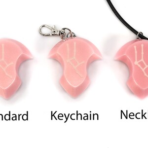 May include: Three pink resin pendants with a white Gemini constellation design. The pendants are shown in three different styles: standard, keychain, and necklace.