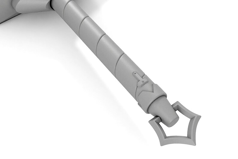 May include: A close-up of the end of a silver sword handle. The handle is decorated with a series of raised rings and a decorative design at the end.