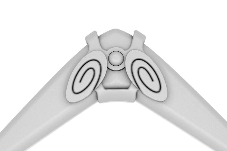 Puede incluir: Un boomerang blanco con dos dise&ntilde;os circulares a cada lado. El boomerang tiene una superficie lisa y redondeada.