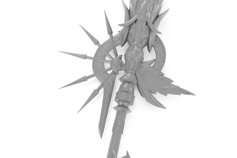 May include: A gray, detailed, 3D printed model of a fantasy weapon. The weapon has a long, ornate handle with a large, winged design at the top. The handle is adorned with intricate carvings and a circular design with spikes radiating outward.