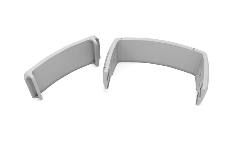 May include: Two light gray, curved, architectural components are displayed against a white background. Each piece has a rounded top and a rectangular base. The pieces are separated, suggesting they may fit together.