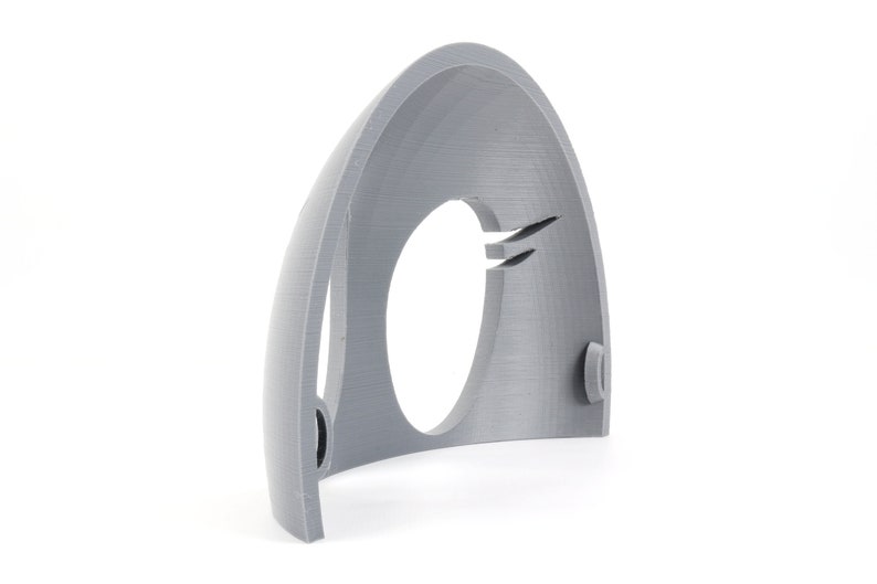 May include: A gray 3D printed plastic half dome with a circular opening in the center. The dome has a smooth, textured surface.