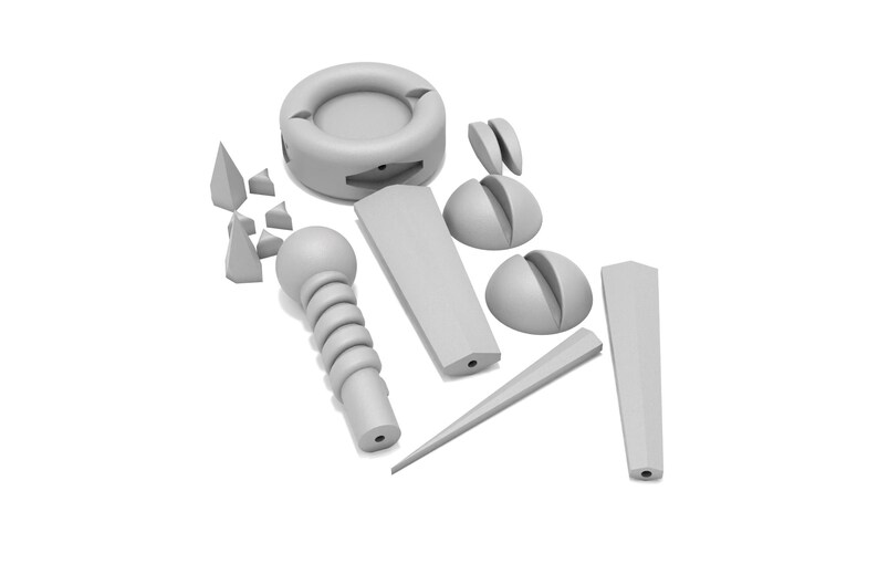 May include: A set of gray plastic pieces for a 3D puzzle. The pieces include a ring, a sphere, a cone, and several smaller pieces.