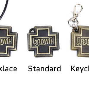 May include: Three variations of a gold-colored metal cross pendant with the word "GROWTH" in black lettering. The cross is available as a necklace, keychain, and standard pendant.