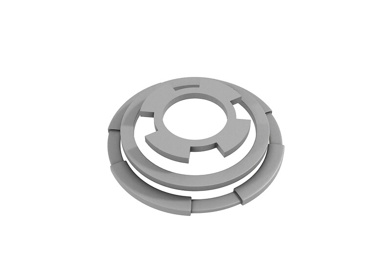 May include: A silver metal washer with a unique design featuring three concentric circles with cutouts. The washer is designed to be used with a screw or bolt.