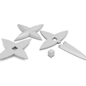 May include: Four white plastic four-pointed stars with a hole in the center. One star is broken into two pieces. A small white cube is also included.