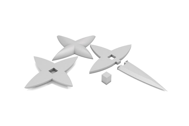 May include: Four white plastic four-pointed stars with a hole in the center. One star is broken into two pieces. A small white cube is also included.