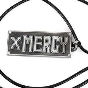 May include: A silver necklace with a rectangular pendant that says "X MERCY" in a pixelated font.