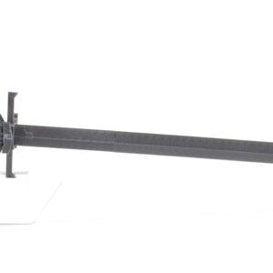 May include: A black metal sword with a decorative hilt and a long, straight blade.