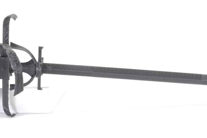 May include: A black metal sword with a decorative hilt and a long, straight blade.