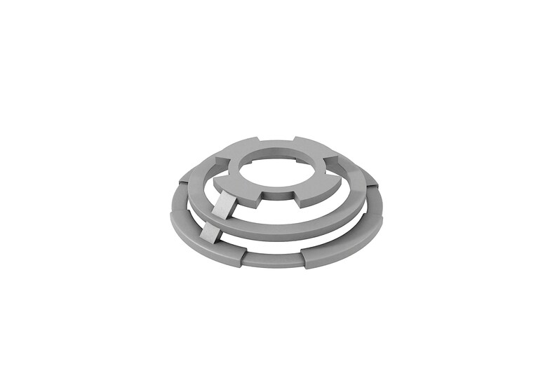 May include: A set of three silver metal washers with a unique, interlocking design. The washers are stacked on top of each other, creating a three-dimensional effect.