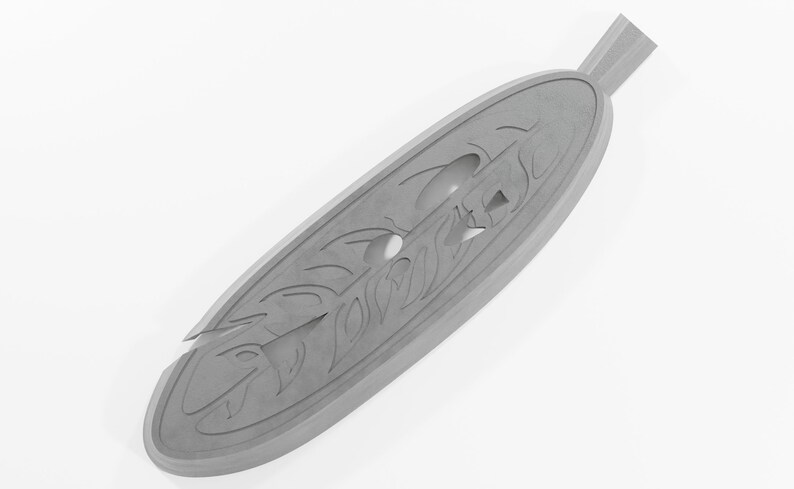 May include: A silver-colored pendant shaped like a feather with intricate carvings and a hole in the center.