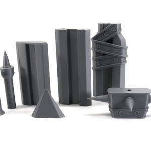 May include: A set of grey 3D printed dungeon accessories for tabletop role-playing games. The set includes a spiked wall, a spiked trap, a spiked club, and a spiked pillar.