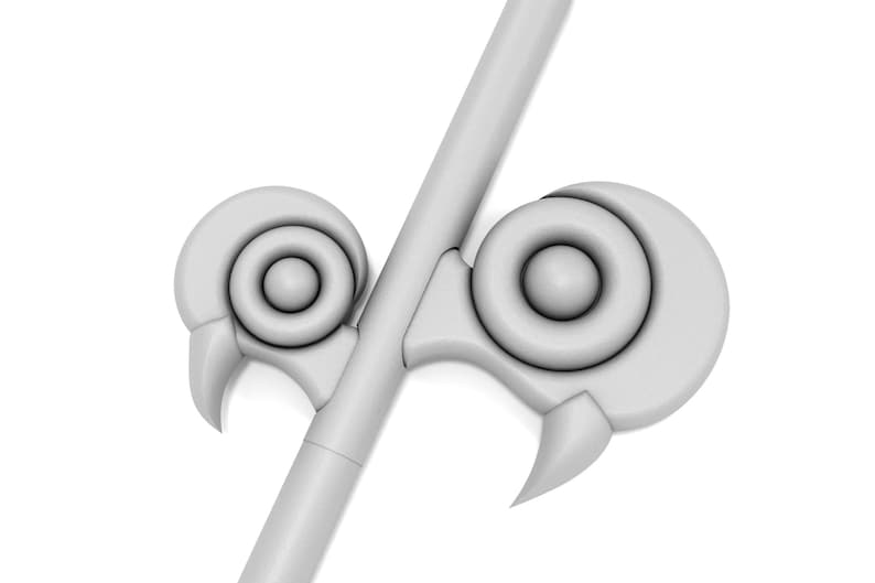 May include: A white, stylized, decorative spearhead with two circular, ring-like protrusions on each side.