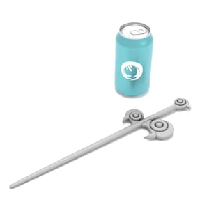 May include: A silver-colored sword with a decorative handle and a blue can with a white logo. The can has a white logo with a stylized flame design.