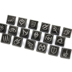 May include: A set of 18 silver-toned metal pins featuring various symbols, including a sword, a shield, a crown, and a musical note. The pins are arranged in a semi-circle on a white background.