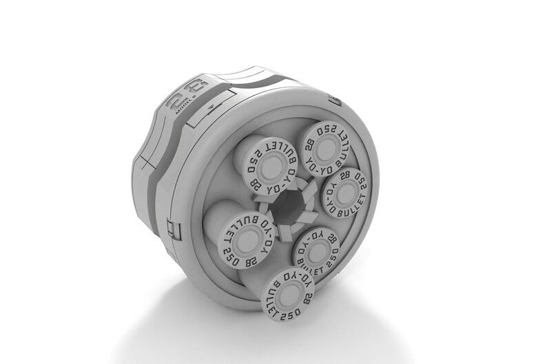 May include: A white plastic cylinder with a rotating mechanism. The cylinder has five slots, each containing a round, white object with the text "BULLET 250 YO-YO 28" printed on it.