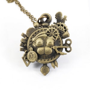 May include: A bronze steampunk-style pendant necklace with a detailed face design and various gears, keys, and other intricate metal accents.
