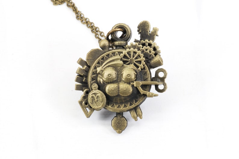 May include: A bronze steampunk-style pendant necklace with a detailed face design and various gears, keys, and other intricate metal accents.