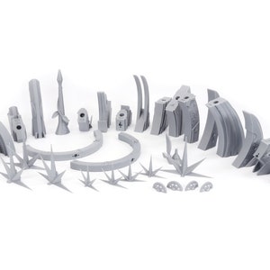 May include: A collection of gray, 3D-printed terrain pieces for tabletop gaming. Includes various structures, arches, spires, and plant-like elements. The pieces are designed to create a detailed and immersive environment for miniature games.