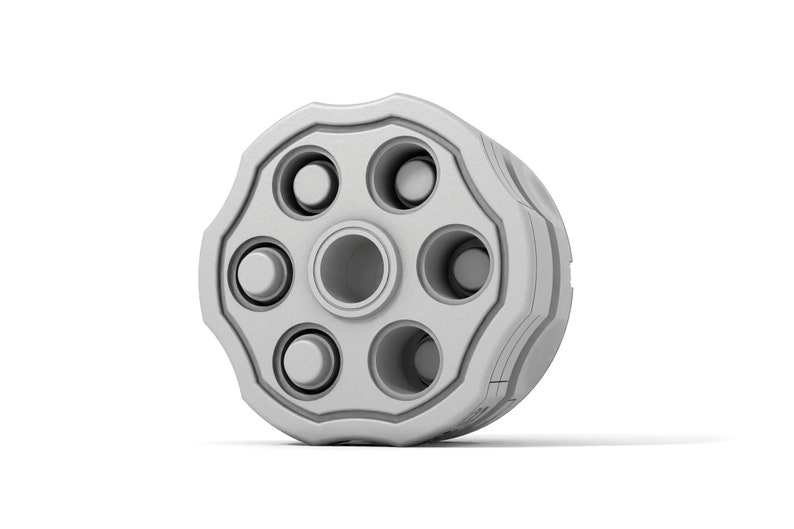 May include: A silver revolver cylinder with six empty chambers.