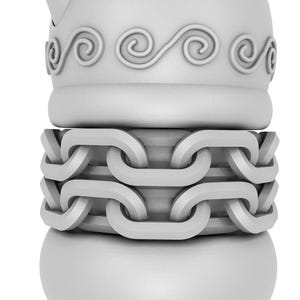 May include: A white ceramic figurine with a chain design around the middle. The top of the figurine has a decorative swirl pattern.