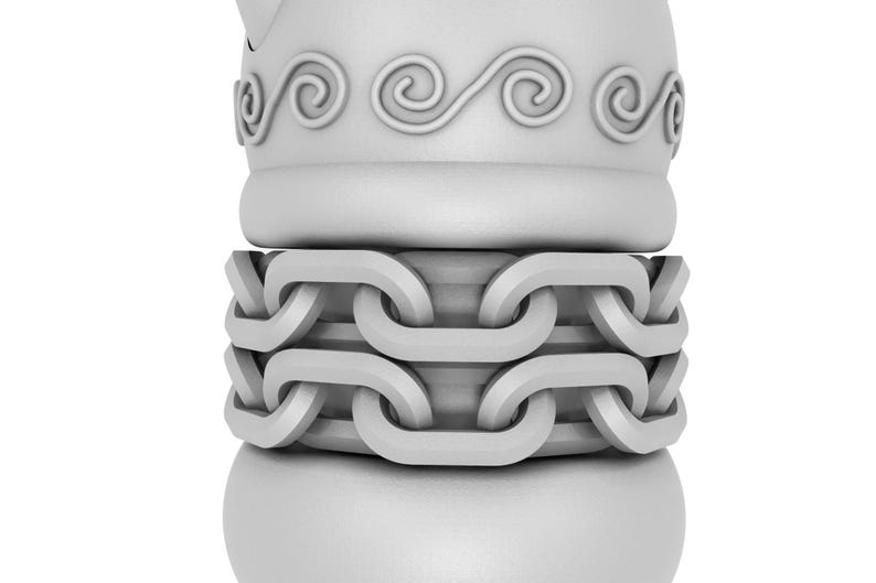 May include: A white ceramic figurine with a chain design around the middle. The top of the figurine has a decorative swirl pattern.