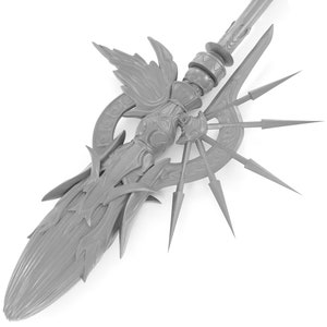 May include: A silver-colored spear with a decorative, ornate design. The spear has a pointed tip and a long, slender shaft. The shaft is decorated with intricate carvings and a circular design with a starburst pattern.
