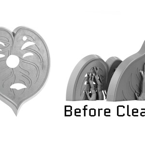 May include: A 3D printed model of a heart-shaped object with a face carved into it. The model is unfinished and has rough edges. The text "Before Cleanup" is visible below the model.