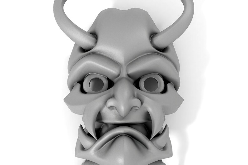 May include: A gray, detailed, 3D printed mask with horns, a large nose, and a wide mouth. The mask has two large eye holes.