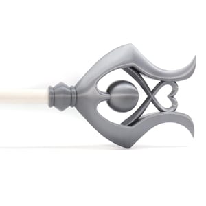 May include: A silver metal curtain rod finial with a decorative design featuring a heart and a circle. The finial is attached to a white curtain rod.