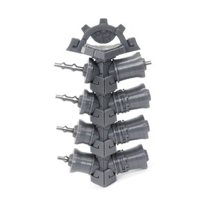 May include: A gray plastic storage rack with five slots for holding small tools or other items. The rack is designed to be stacked on top of other racks.