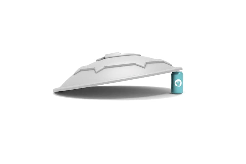Puede incluir: Una tapa de pl&aacute;stico blanca en forma de c&uacute;pula con un dise&ntilde;o de estrella. La tapa est&aacute; apoyada sobre una lata azul con un logotipo blanco.