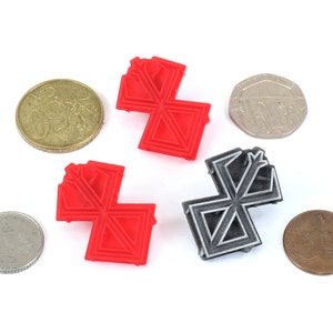 May include: Two 3D printed geometric shapes, one red and one grey, with a complex design. The shapes are similar in size and shape, and are arranged in a symmetrical pattern.