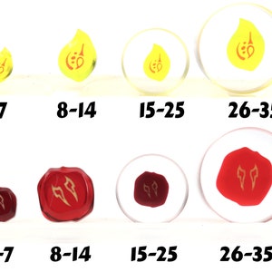 May include: Four sets of dice with different sizes. The dice are yellow with a red symbol and red with a gold symbol. The dice are labeled with numbers 3-7, 8-14, 15-25, and 26-35.