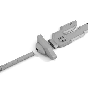 May include: A gray plastic sword with a futuristic design. The sword is disassembled into three pieces: the blade, the hilt, and the pommel.