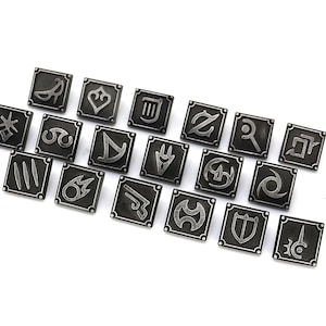 May include: A collection of twenty square, silver-colored metal pins, each featuring a unique symbol. The pins are arranged diagonally on a white surface. The symbols appear to be stylized icons, possibly from a game or fantasy theme.