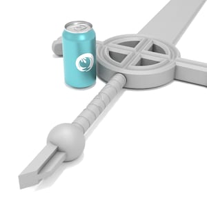 May include: A white sword with a cross-shaped guard and a round pommel. A blue can with a white logo is next to the sword.